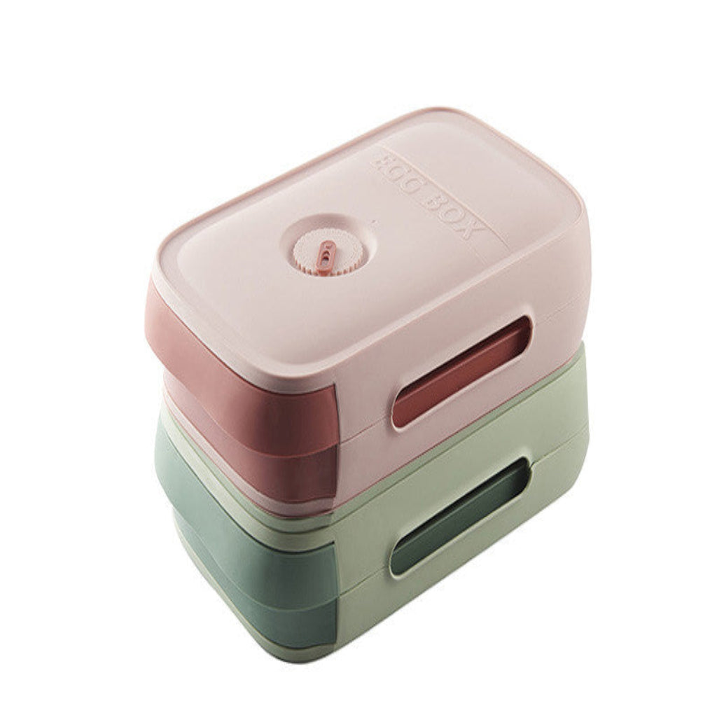 Two-tone pink and green rectangular container on a white background