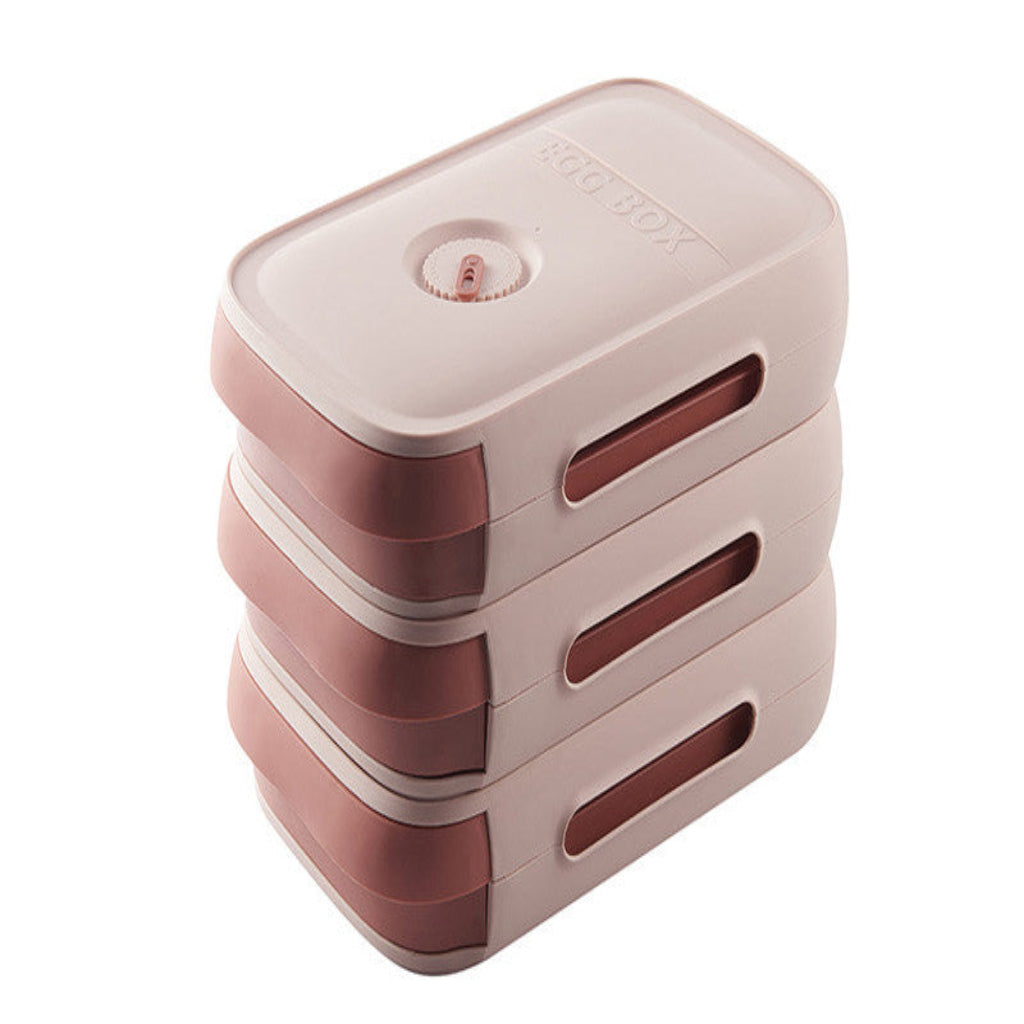 Stack of pink and beige containers on a white background