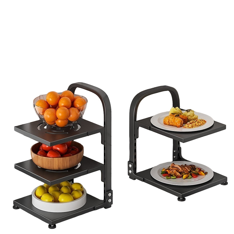 Multi-tiered fruit and vegetable rack with bowls of fruits and vegetables on a marble countertop.