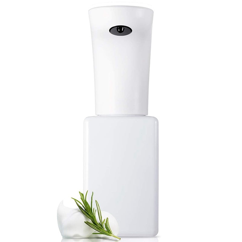 White spray bottle with a green leaf on a white background