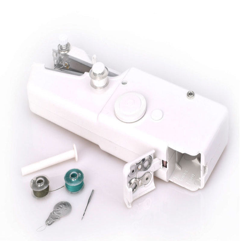 White sewing machine with various parts on a white background