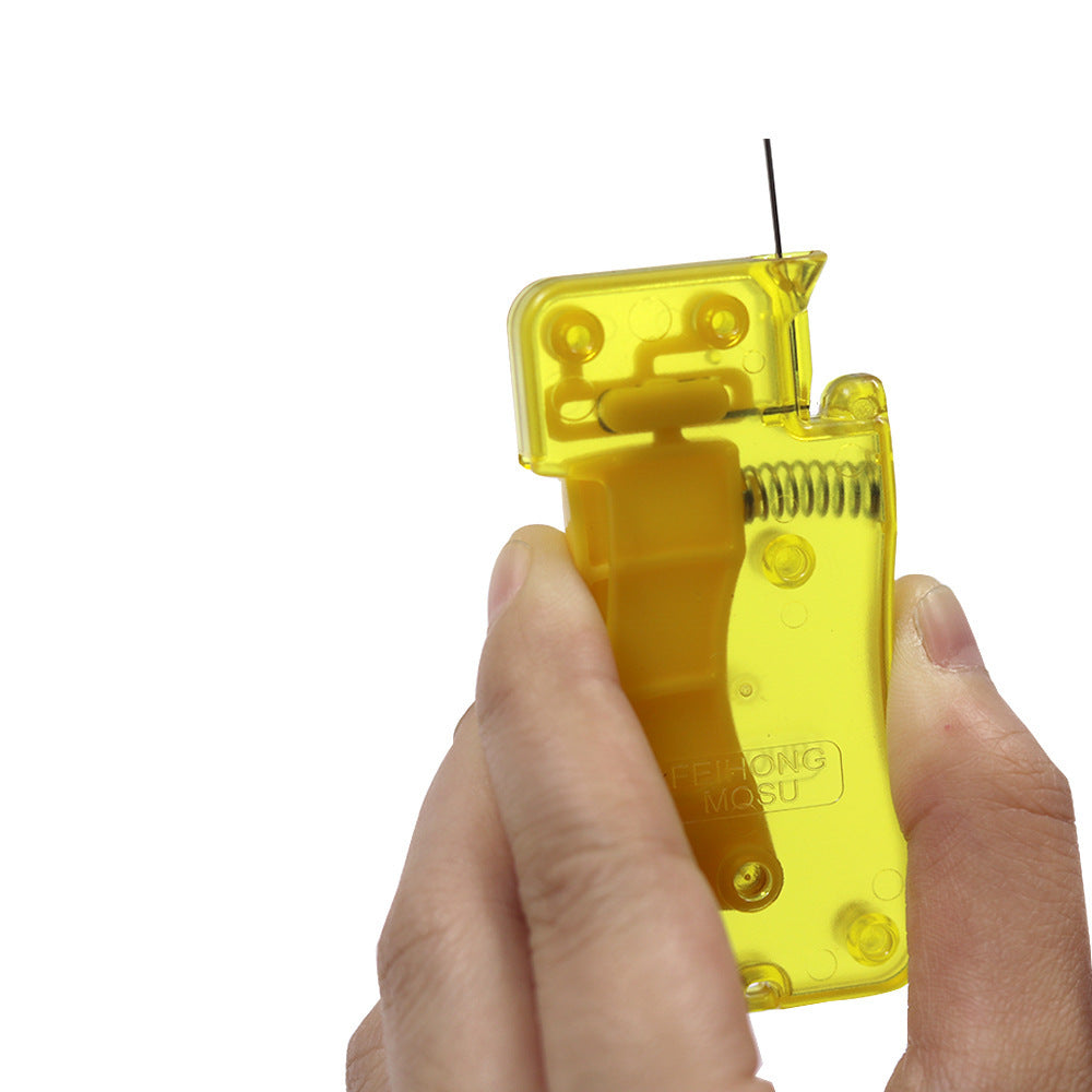 Hand holding a yellow plastic tool with visible branding on a white background