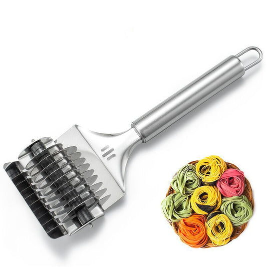 Metal pasta roller with colorful pasta on a white background