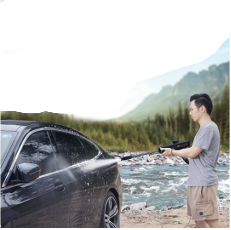Person washing a car outdoors with text about battery-powered design.