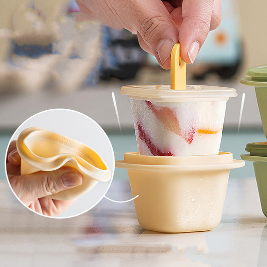 Hand using a yellow popsicle mold with a close-up of the mold's texture.