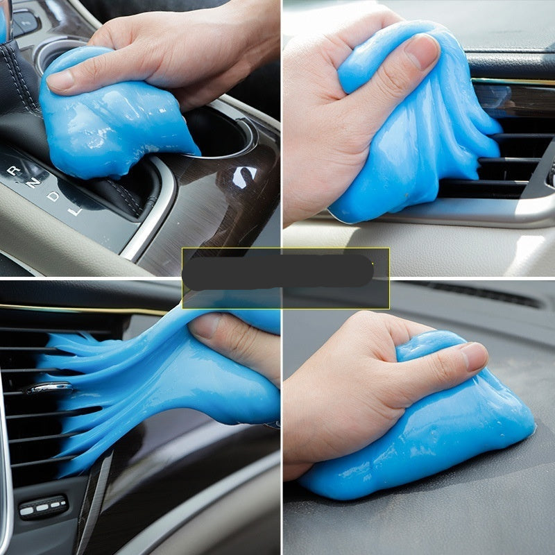 Blue car cleaning gel being used on car interior components.