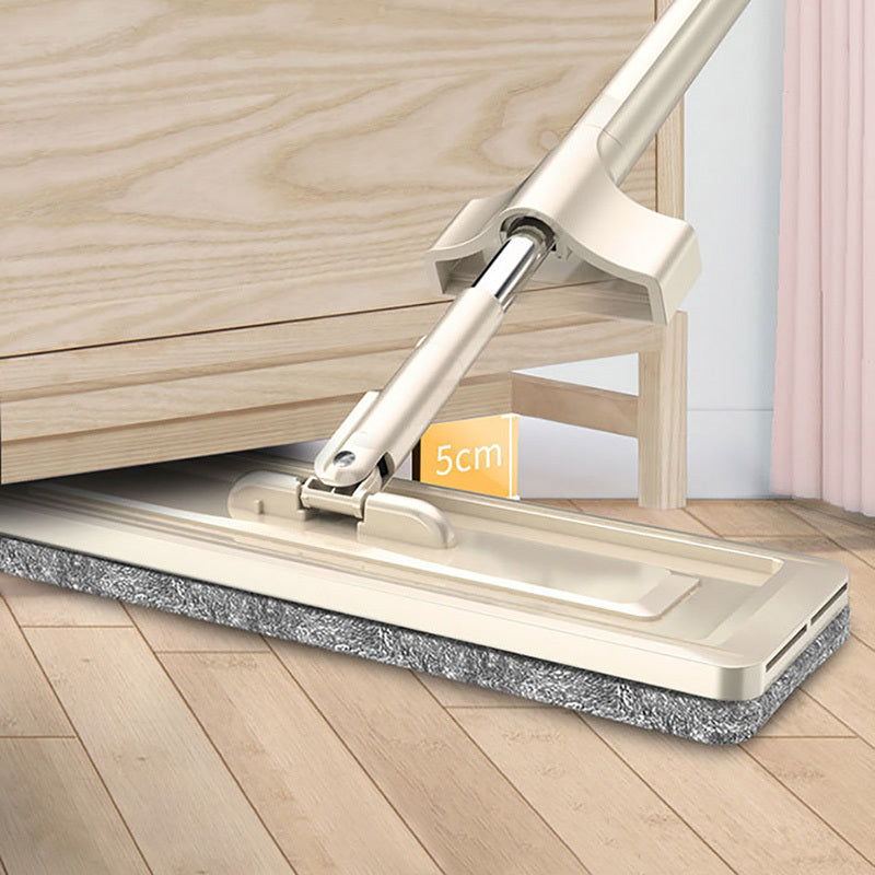 Mop with a flat cleaning pad on a wooden floor