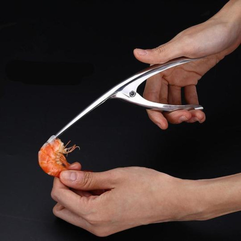 Person using a pair of shrimp peeling scissors on a black background