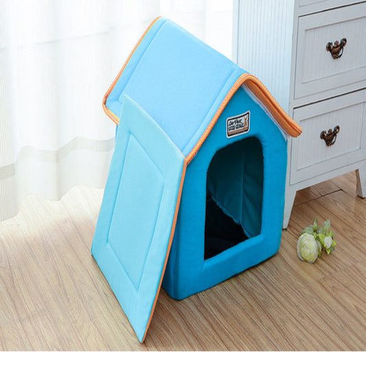Blue pet house with orange trim on a wooden floor.
