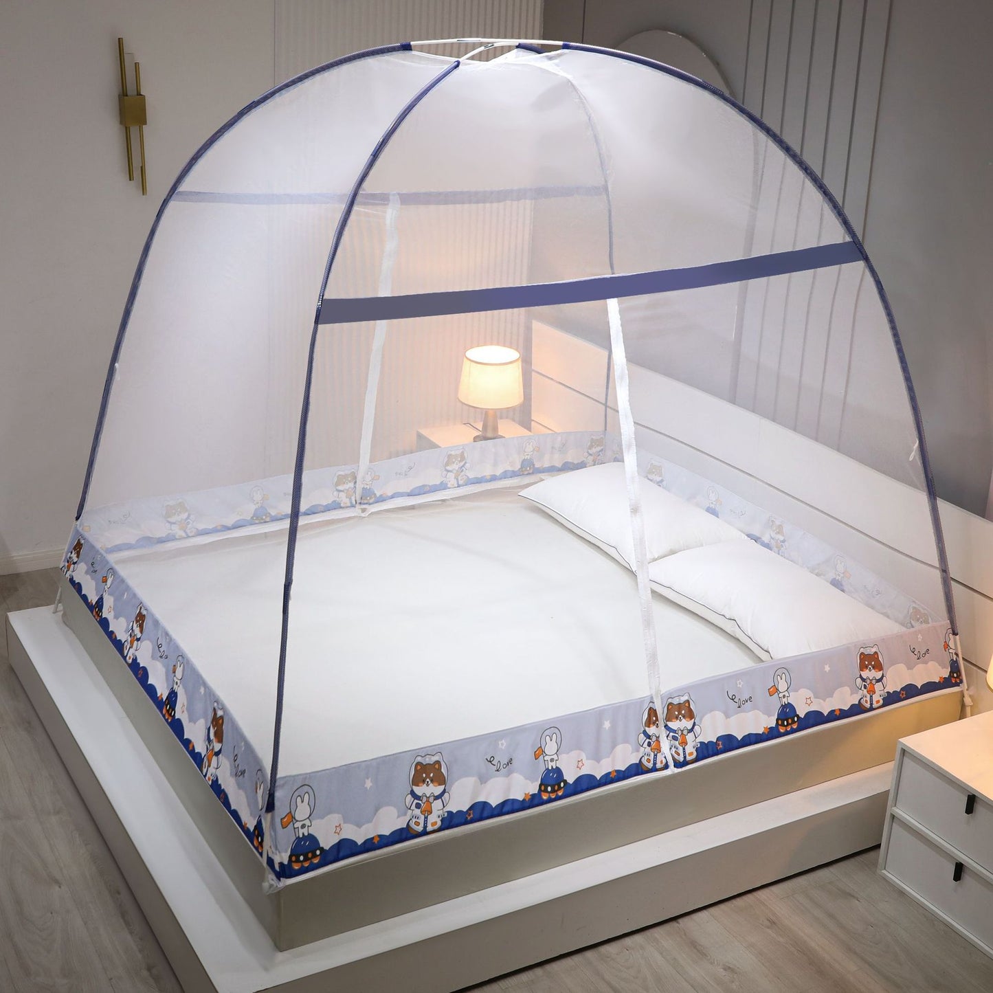 Bed with a mosquito net in a bedroom setting