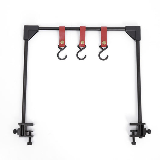 Black metal frame with red hooks on a white background