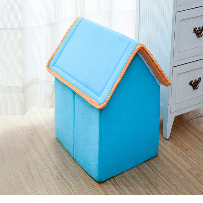 Blue pet house with orange trim on a wooden floor.