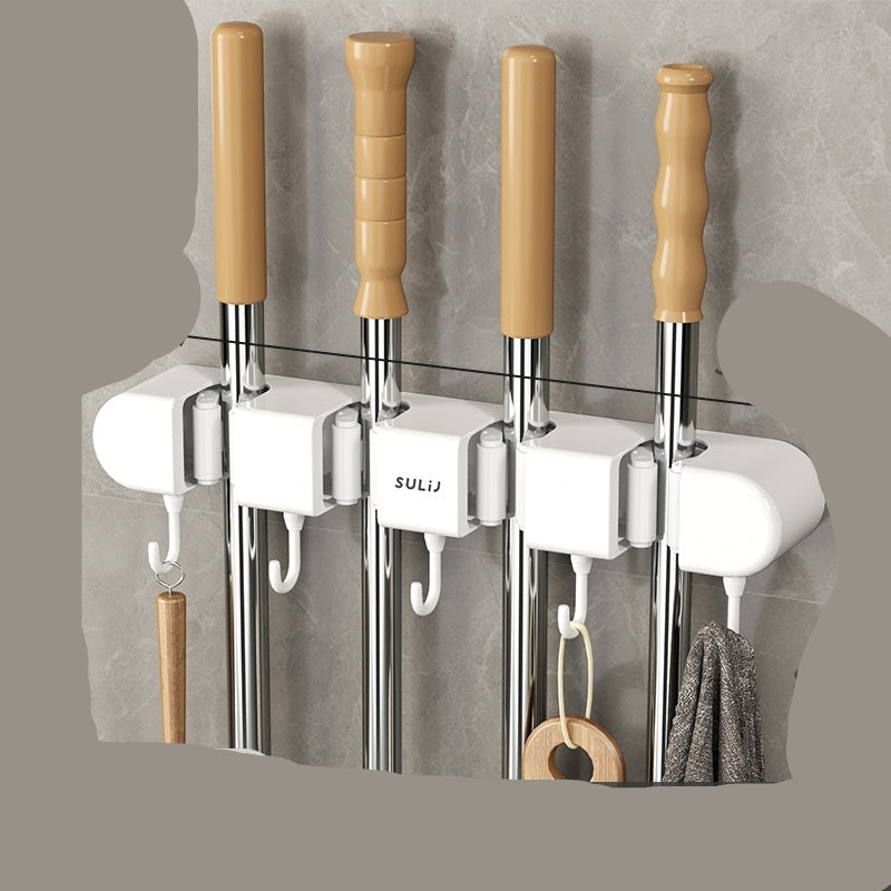 Wall-mounted kitchen tool holder with four metal rods and wooden handles, showing measurements and brand name.