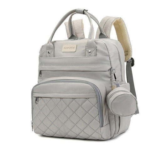Gray quilted backpack with a small pouch on a white background
