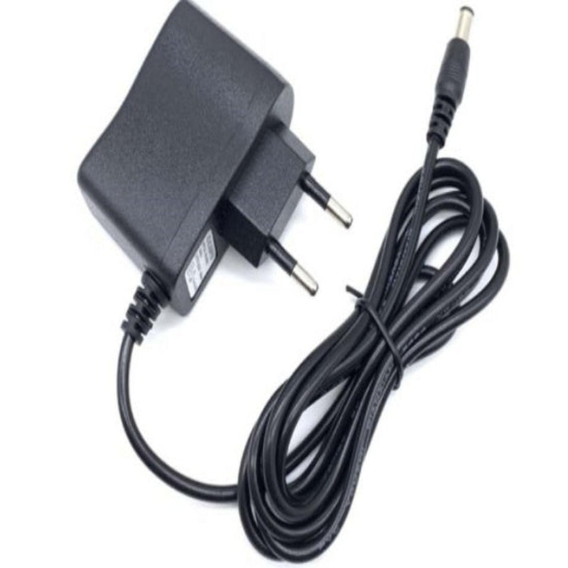 Black power adapter with a coiled cable on a white background