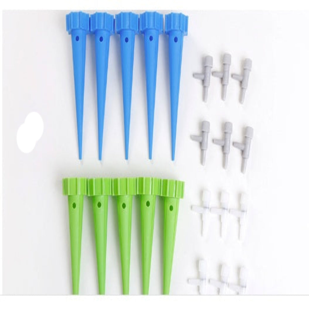 Set of blue and green plastic nozzles on a white background