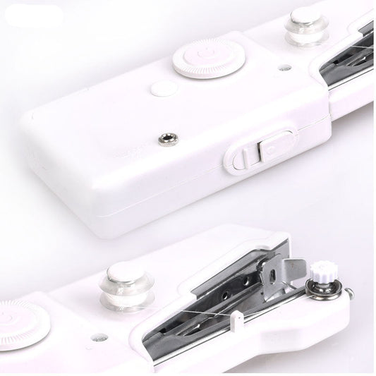 Close-up of a white electronic device with metal components on a light gray background