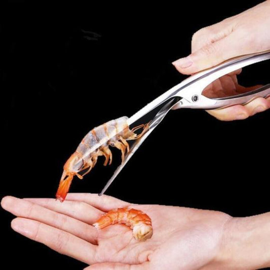 Shrimp being deveined with a pair of scissors on a black background