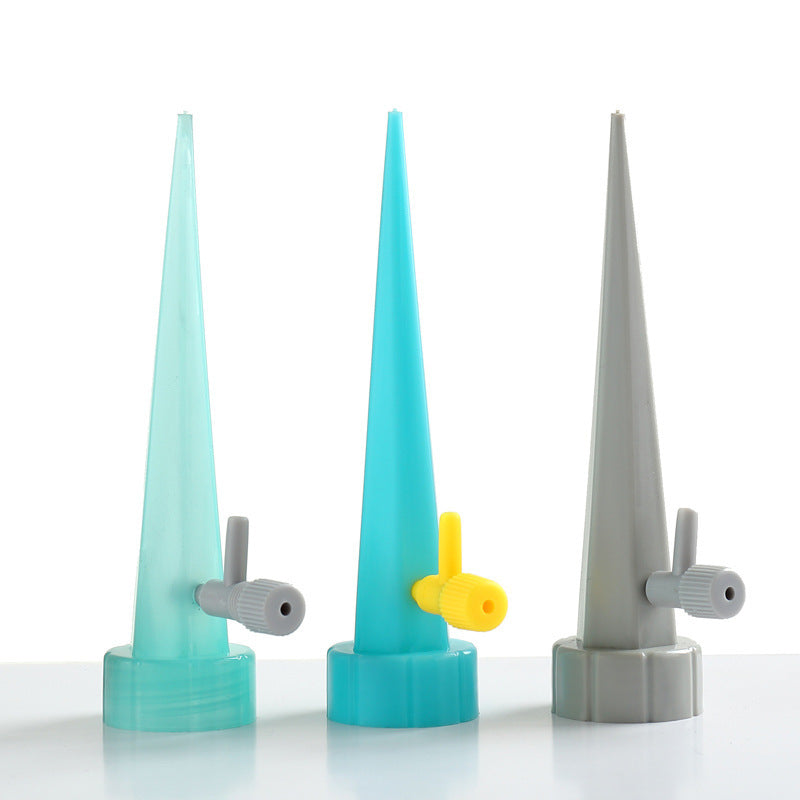 Three cone-shaped nozzles with gray and yellow components on a white background