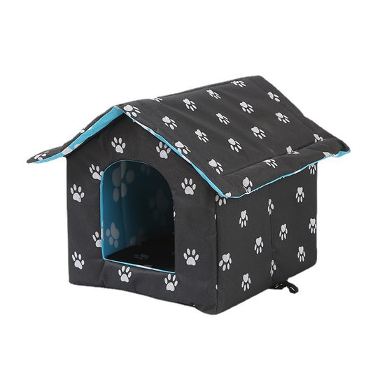Black pet house with white paw prints and a blue interior on a white background
