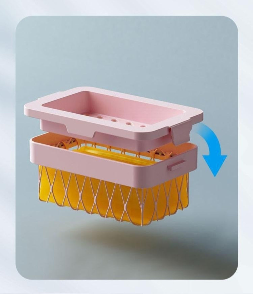 Pink and yellow plastic tool with large snap button on a light gray background