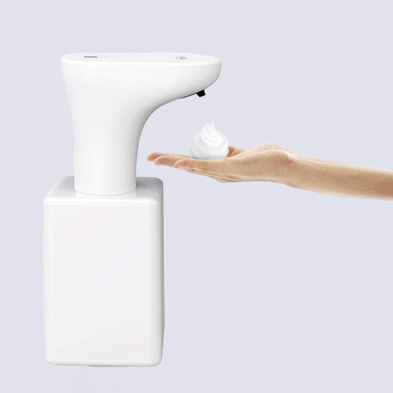 Hand soap dispenser with a hand reaching out to dispense soap, on a white background.
