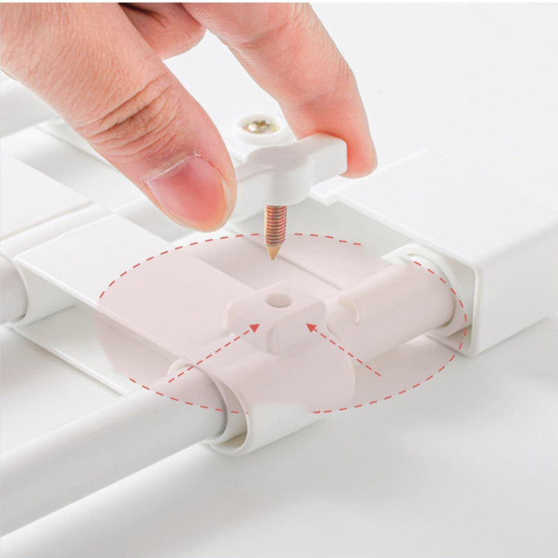 Hand adjusting a white plastic component on a white background