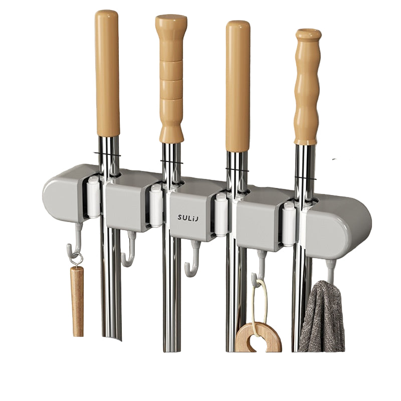 Set of four metal rods with wooden handles and hooks on a gray wall.