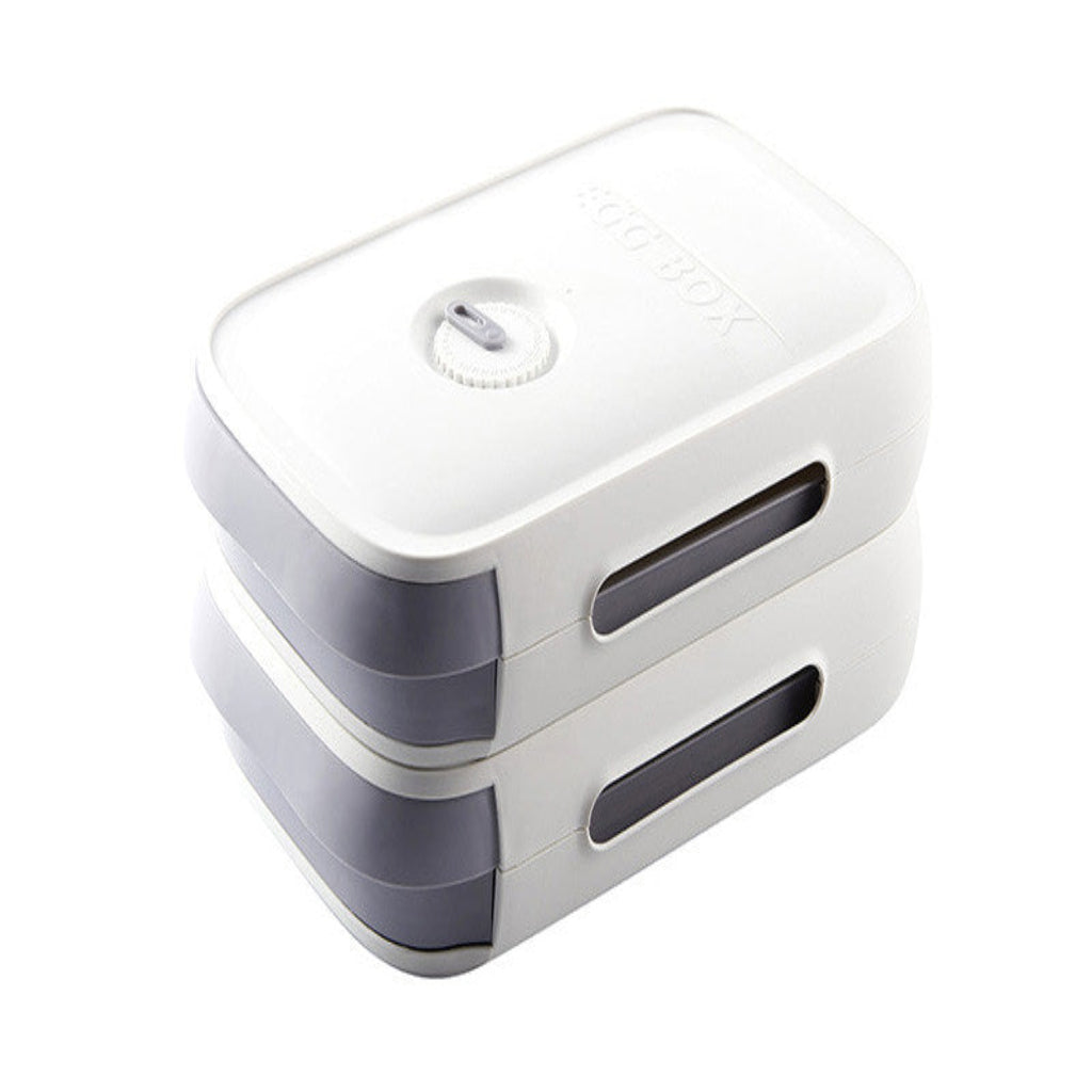 White and gray rectangular device with a circular component on a white background