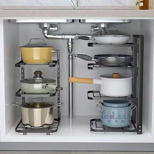 Kitchen cabinet with a pot and pan organizer holding various cookware.
