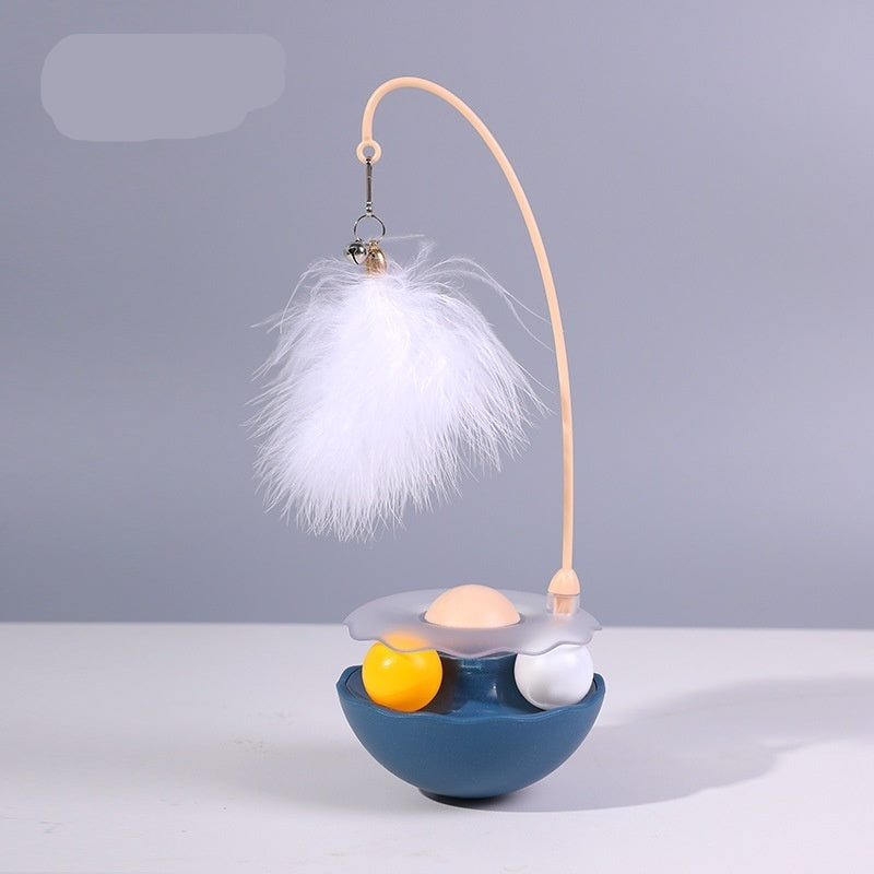 Decorative lamp with feathers and colorful balls on a gray background, branded 'Indigo'.