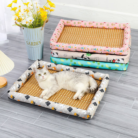 Cat lying on a patterned pet bed with other similar beds stacked in the background.