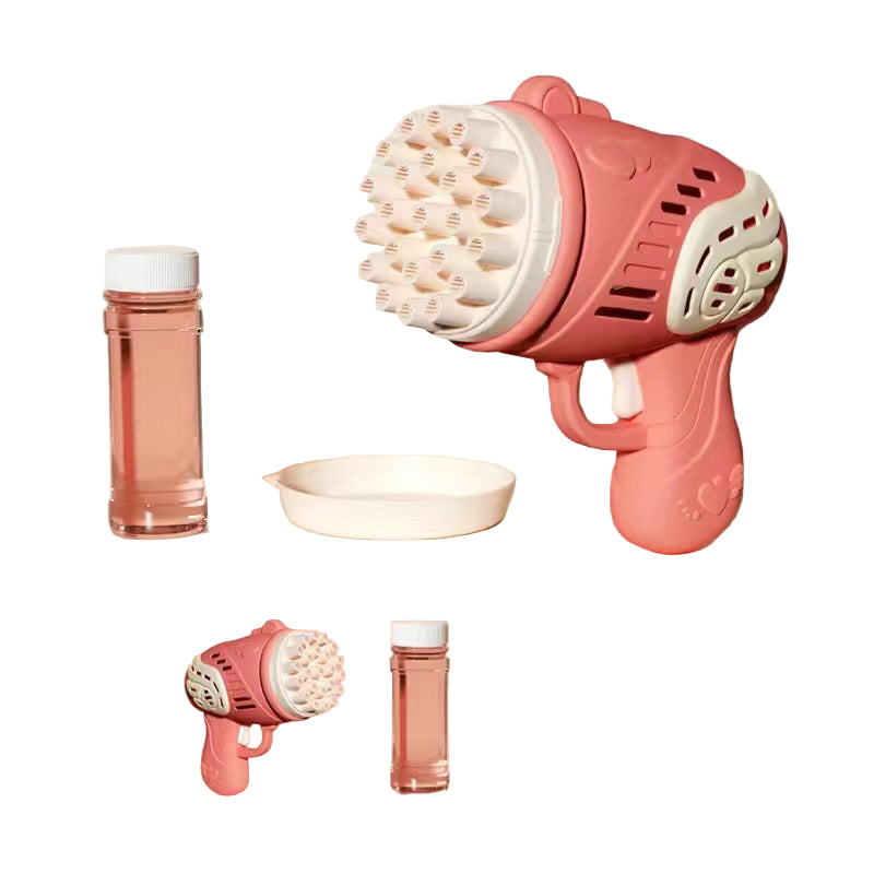 Pink bubble gun with accessories on a beige background