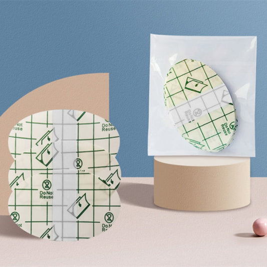 Reusable pads with packaging on a blue and beige background