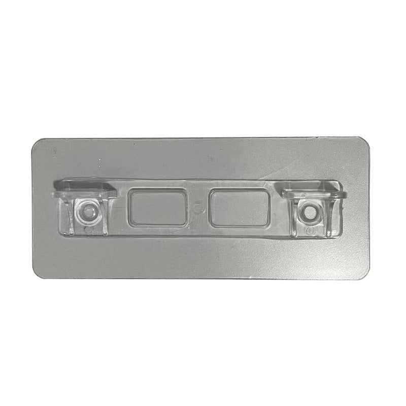 Metallic rectangular object with embedded components on a white background