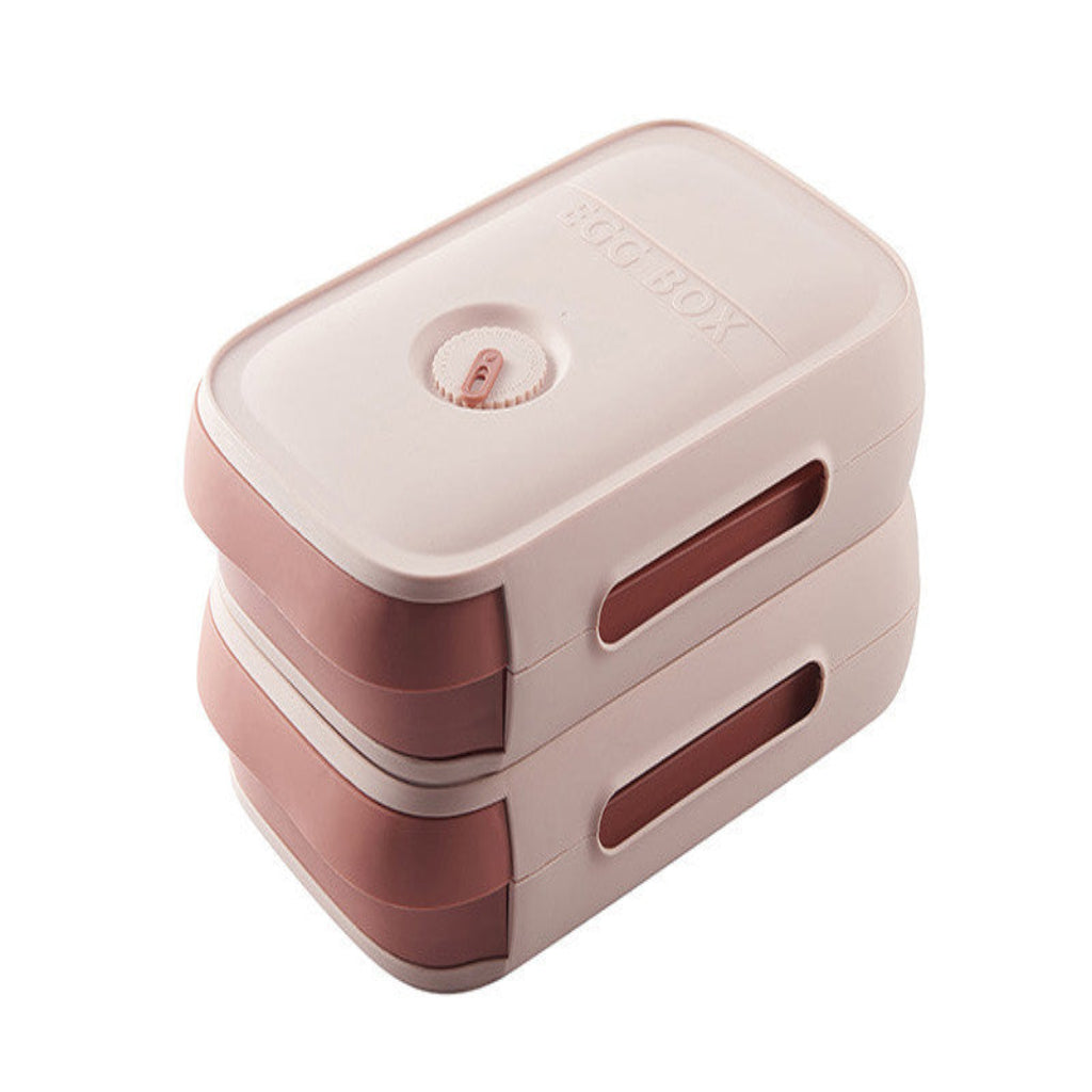 Pink and white rectangular container with a lid on a white background