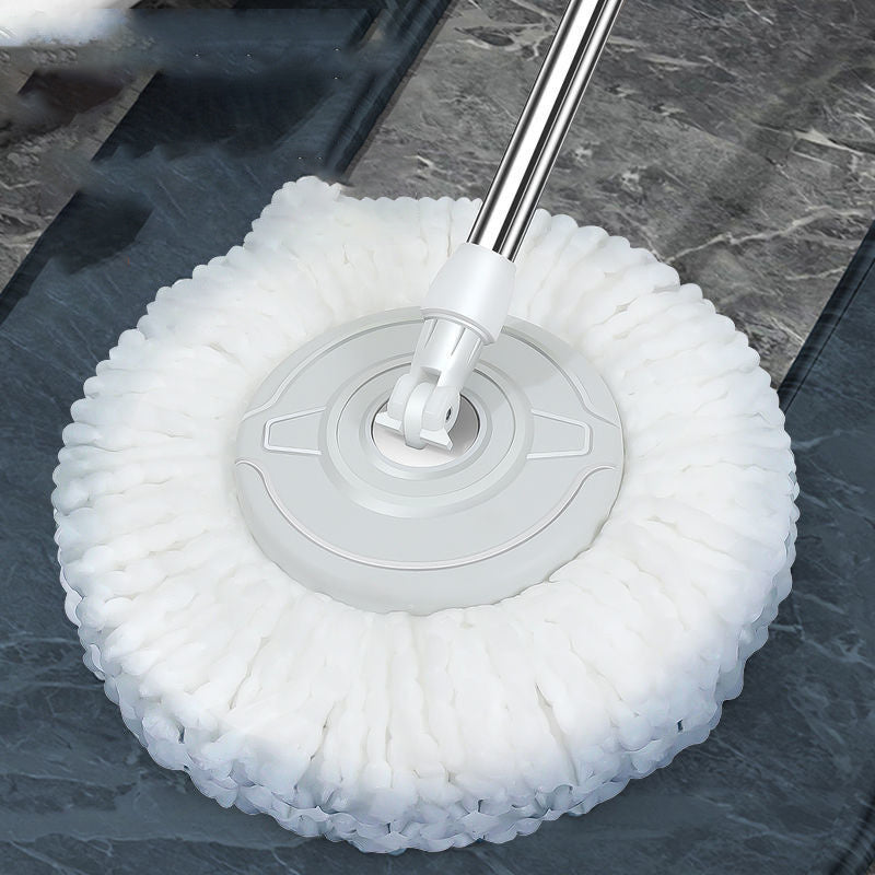 Cleaning tool with white bristle head on a dark surface