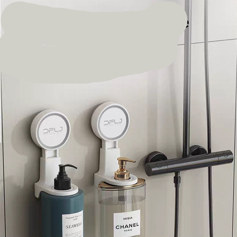 Shower room with shower gel and shampoo bottles mounted on the wall.