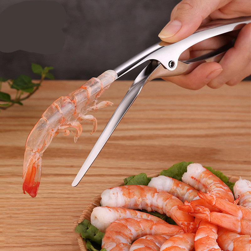 Shrimp scissors cutting a shrimp with a plate of shrimp in the background, branded 'Cyan Peak'.