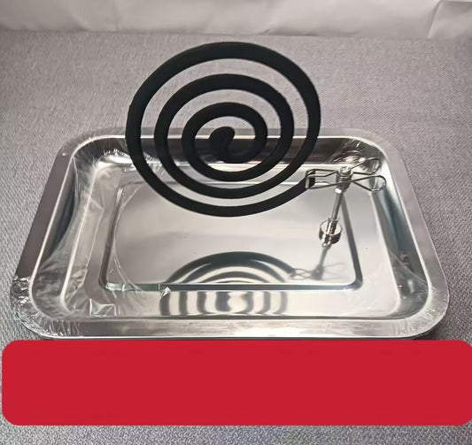 Mosquito coil holder with a spiral mosquito coil on a gray background