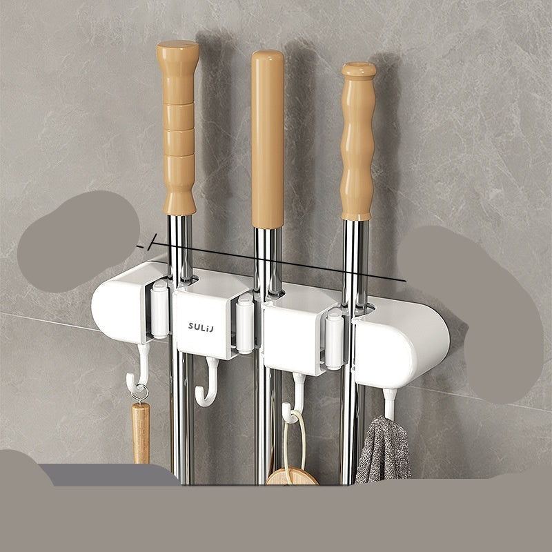 Three white hooks with wooden handles attached to a gray wall, showing measurements.