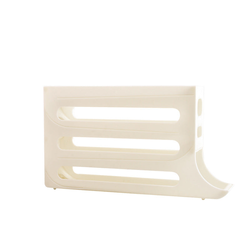 Beige plastic component on a white background