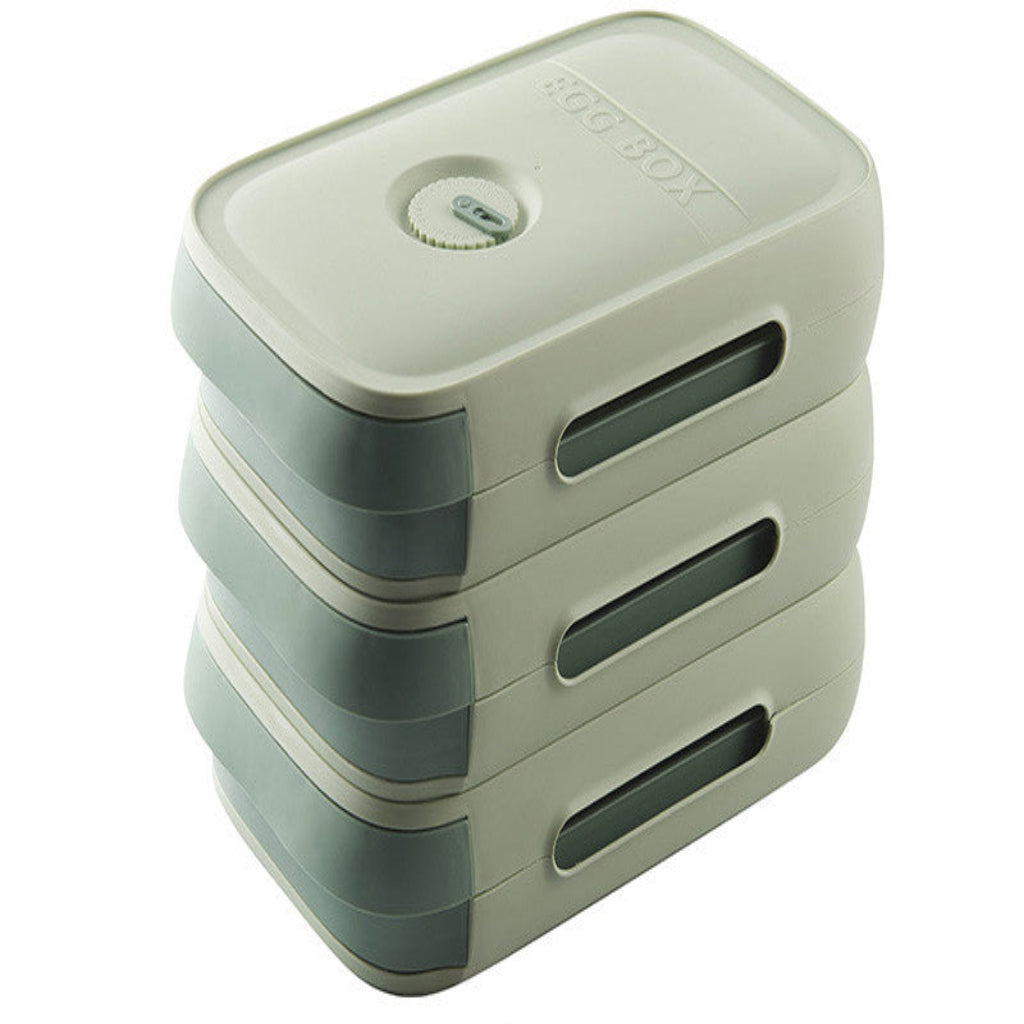 Stack of green plastic containers with a lid on a white background
