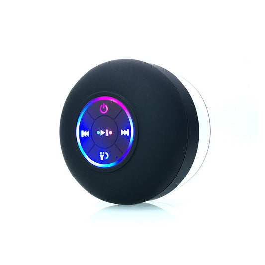 Black round device with colorful display on a white background