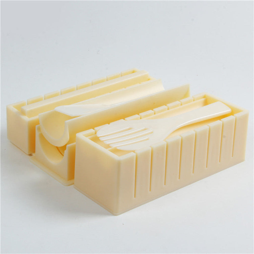 Beige plastic butter mold on a white background