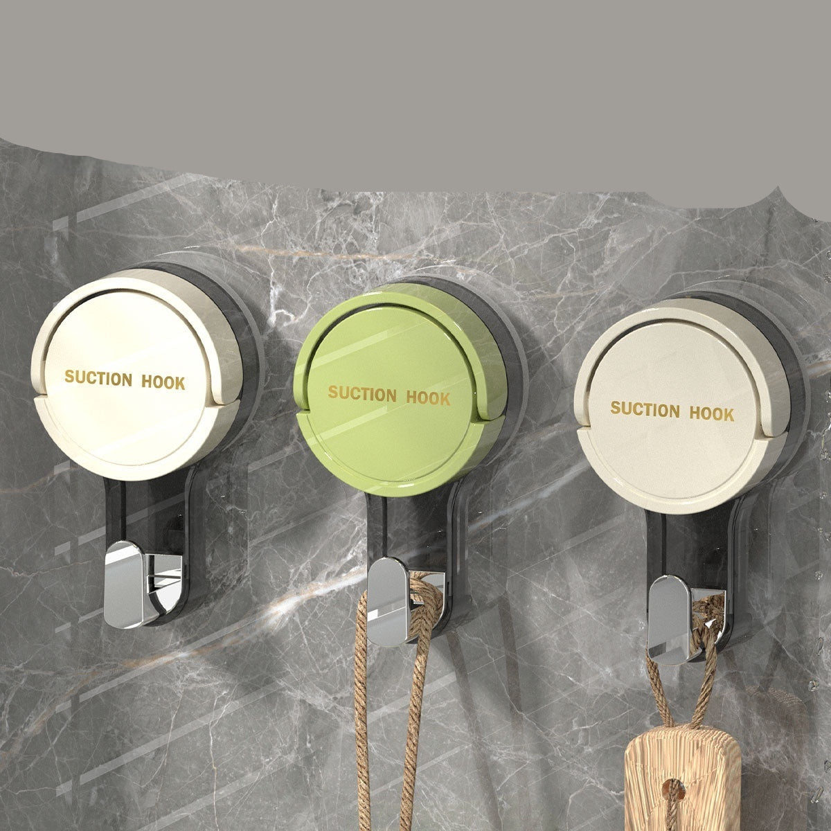 Three suction cup hooks on a marble wall with text describing their features.
