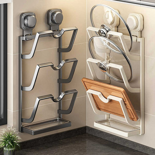 Wall-mounted kitchen storage rack with shelves and a lid holder on a tiled wall.