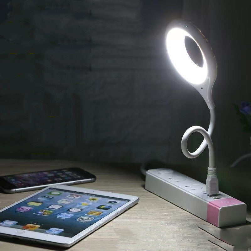 Flexi light on a desk with a tablet and smartphone in the foreground