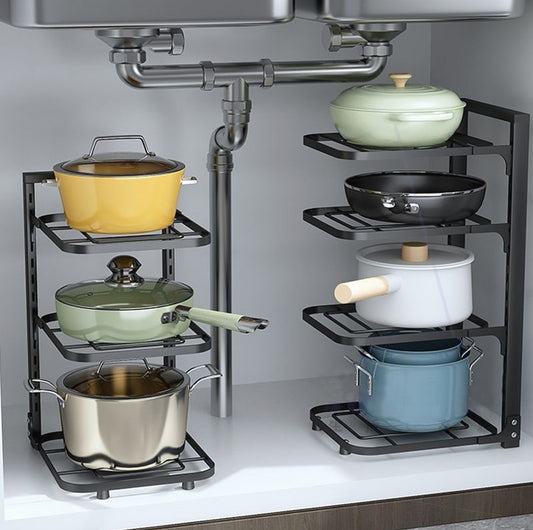 Kitchen storage rack with pots and pans on a gray background