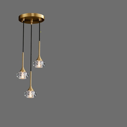 Three-head disc pendant light with crystal elements on a gray background